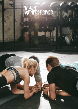 photo of individuals in a circle doing the plank in a fitness setting